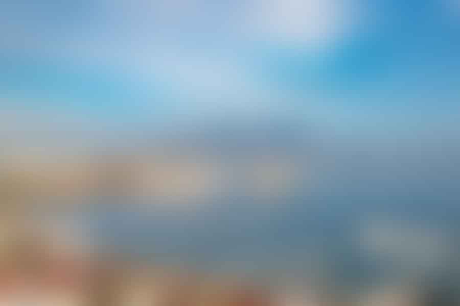 Panoramic view of Naples cityscape with Mount Vesuvius in the backdrop