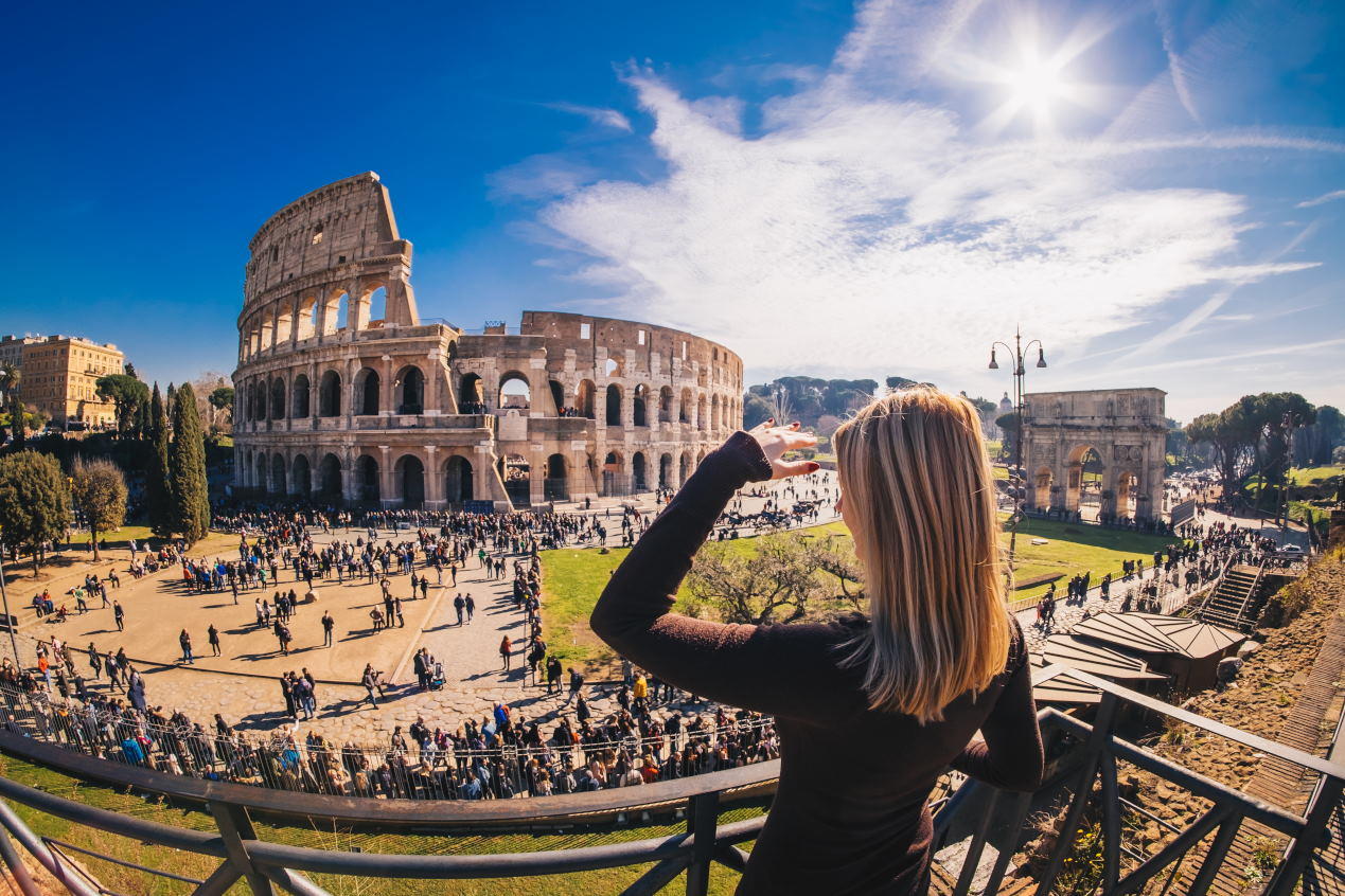 Panoramic view of Rome with the Colosseum in the foreground